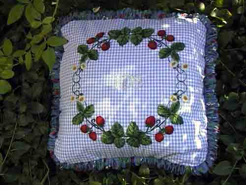 Wood embroidery cushion designed by Tricia Hood
